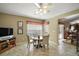 Cozy dining area with a round table, three chairs, and a view to the lanai at 932 Medira Dr, The Villages, FL 32159