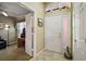 Welcoming foyer featuring tile flooring, decorative window, and direct access to a sunny home office space at 932 Medira Dr, The Villages, FL 32159