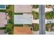 Aerial view of the property showing roof, lawn, and surrounding neighborhood at 17454 Se 81St Newberry Ct, The Villages, FL 32162