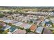 Expansive aerial view of a well-maintained residential community with lush green spaces and manicured lawns at 17454 Se 81St Newberry Ct, The Villages, FL 32162
