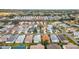 Beautiful aerial shot showcasing a vibrant neighborhood with diverse home styles and tree-lined streets at 17454 Se 81St Newberry Ct, The Villages, FL 32162