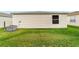 Backyard with lush green grass at 17454 Se 81St Newberry Ct, The Villages, FL 32162