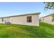 Backyard showing a side of house at 17454 Se 81St Newberry Ct, The Villages, FL 32162
