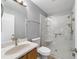 Bathroom with a modern marble shower and sleek vanity at 17454 Se 81St Newberry Ct, The Villages, FL 32162