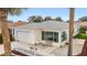 Charming single-story home with a well-manicured lawn and a white picket fence in a desirable neighborhood at 17454 Se 81St Newberry Ct, The Villages, FL 32162