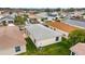 Backyard aerial featuring a well-manicured lawn, mature landscaping, and an inviting outdoor space at 17454 Se 81St Newberry Ct, The Villages, FL 32162
