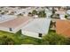 Well-kept backyard featuring a tidy lawn, groomed greenery, and a pleasant outdoor living area at 17454 Se 81St Newberry Ct, The Villages, FL 32162