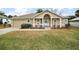 Charming single-story home with manicured front yard and attached garage at 11053 Se 174Th Loop, Summerfield, FL 34491