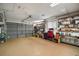Spacious garage with ample shelving and storage solutions for all your organizational needs at 11053 Se 174Th Loop, Summerfield, FL 34491