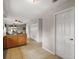 Bright hallway with white walls, tile flooring, and closet doors leading to rooms at 11053 Se 174Th Loop, Summerfield, FL 34491