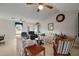 Spacious living room with ceiling fans, tile floors, and comfortable seating at 11053 Se 174Th Loop, Summerfield, FL 34491