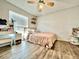 Bedroom featuring hard wood floors, closet space, and a vanity area at 1209 Demoiselle St, Groveland, FL 34736
