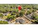 Aerial view of property showcasing the spacious lot, surrounding neighborhood, and mature trees at 1212 Windy Bluff Dr, Minneola, FL 34715