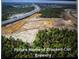 Aerial view of the future location for Crooked Can Brewery, near a highway and surrounded by trees at 1212 Windy Bluff Dr, Minneola, FL 34715