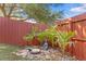 Zen backyard garden with a tranquil Buddha statue providing a peaceful outdoor retreat at 1212 Windy Bluff Dr, Minneola, FL 34715