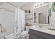 Well-maintained bathroom with a shower-tub combination and modern fixtures at 1212 Windy Bluff Dr, Minneola, FL 34715