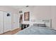 Well-lit bedroom with a closet and simple furnishings at 1212 Windy Bluff Dr, Minneola, FL 34715