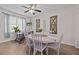 Cozy dining room with an accent wall, chandelier, and an adjacent area with a desk at 1212 Windy Bluff Dr, Minneola, FL 34715