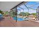 Gorgeous screened in pool with hot tub and a spacious patio area for outdoor gatherings and leisure at 1212 Windy Bluff Dr, Minneola, FL 34715