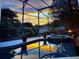 Backyard pool with a breathtaking sunset view providing a tranquil outdoor oasis at 1212 Windy Bluff Dr, Minneola, FL 34715