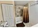 Neutral toned bathroom featuring tile backsplash in the shower/tub at 127 Hibiscus Way, Leesburg, FL 34748