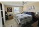 Well-lit bedroom featuring a soft quilt and a large window for ample natural light at 127 Hibiscus Way, Leesburg, FL 34748