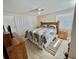 This is a well-lit bedroom with a cozy quilt and plenty of room for storage at 127 Hibiscus Way, Leesburg, FL 34748