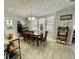 Cozy dining area with wood-style laminate flooring and natural light at 127 Hibiscus Way, Leesburg, FL 34748