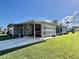Attractive single-story home with well-manicured lawn and covered parking at 127 Hibiscus Way, Leesburg, FL 34748