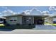 Charming single-story home with carport and well-maintained landscaping at 127 Hibiscus Way, Leesburg, FL 34748
