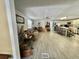 Open concept living area with laminate flooring and neutral decor at 127 Hibiscus Way, Leesburg, FL 34748