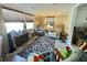 Comfortable living room with multiple seating options and tiled floor at 127 Hibiscus Way, Leesburg, FL 34748