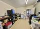 Well-organized garage featuring storage solutions and utility sink at 127 Hibiscus Way, Leesburg, FL 34748