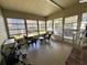 Spacious sunroom with tile flooring, perfect for relaxing or entertaining at 127 Hibiscus Way, Leesburg, FL 34748