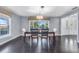 Formal dining room with hardwood floors and a window with a view at 12802 Amber Ave, Clermont, FL 34711