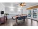Dining area with hardwood floors, ceiling fan and french doors to backyard at 12802 Amber Ave, Clermont, FL 34711