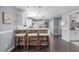 Open kitchen area with bar seating, perfect for entertaining and casual dining at 12802 Amber Ave, Clermont, FL 34711