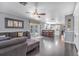 Open living area with hardwood floors, natural light, and seamless flow to kitchen at 12802 Amber Ave, Clermont, FL 34711