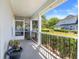 Screened porch overlooking the well-maintained backyard with a privacy fence and lush greenery at 12802 Amber Ave, Clermont, FL 34711