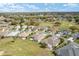 High aerial view of a residential neighborhood near a golf course showcasing the area's lush green landscaping at 13146 Se 91St Court Rd, Summerfield, FL 34491