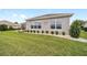 Desirable backyard features a beautiful yard with mature landscaping and an enclosed patio area at 13146 Se 91St Court Rd, Summerfield, FL 34491