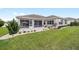 Wonderful backyard featuring a screened lanai, manicured lawn, and beautiful landscaping at 13146 Se 91St Court Rd, Summerfield, FL 34491