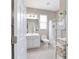 Bathroom featuring a shower with a curtain, toilet, and a sink with a vanity and mirror at 13146 Se 91St Court Rd, Summerfield, FL 34491