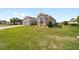 Well-maintained single-Gathering home featuring a manicured lawn and attractive landscaping showcasing suburban living at 13146 Se 91St Court Rd, Summerfield, FL 34491