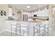 Bright kitchen features granite counters, stainless steel appliances, and barstool seating at 13146 Se 91St Court Rd, Summerfield, FL 34491