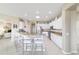 Bright kitchen features granite counters, stainless steel appliances, and barstool seating at 13146 Se 91St Court Rd, Summerfield, FL 34491