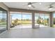 Enjoy the view from the lanai with ceiling fans, and beautiful view of the golf course and lush landscaping at 13146 Se 91St Court Rd, Summerfield, FL 34491