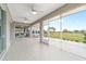 Spacious lanai with ceiling fans overlooking the golf course at 13146 Se 91St Court Rd, Summerfield, FL 34491