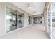 Spacious screened lanai, with multiple access points from the interior of the home at 13146 Se 91St Court Rd, Summerfield, FL 34491