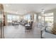 Open-concept living area flows to dining, with tile floors and abundant natural light at 13146 Se 91St Court Rd, Summerfield, FL 34491